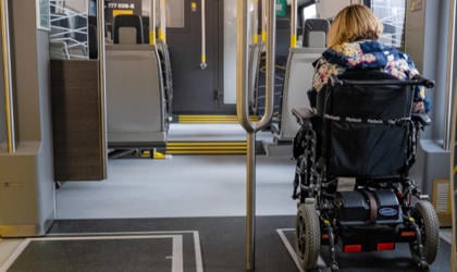 A passenger using a wheelchair is travelling on board a 777 train.  